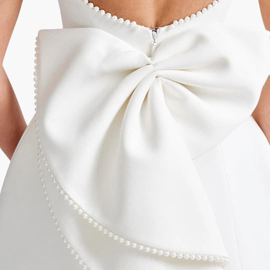 Women’s mini dress with sleeveless cut and pearl embellishments